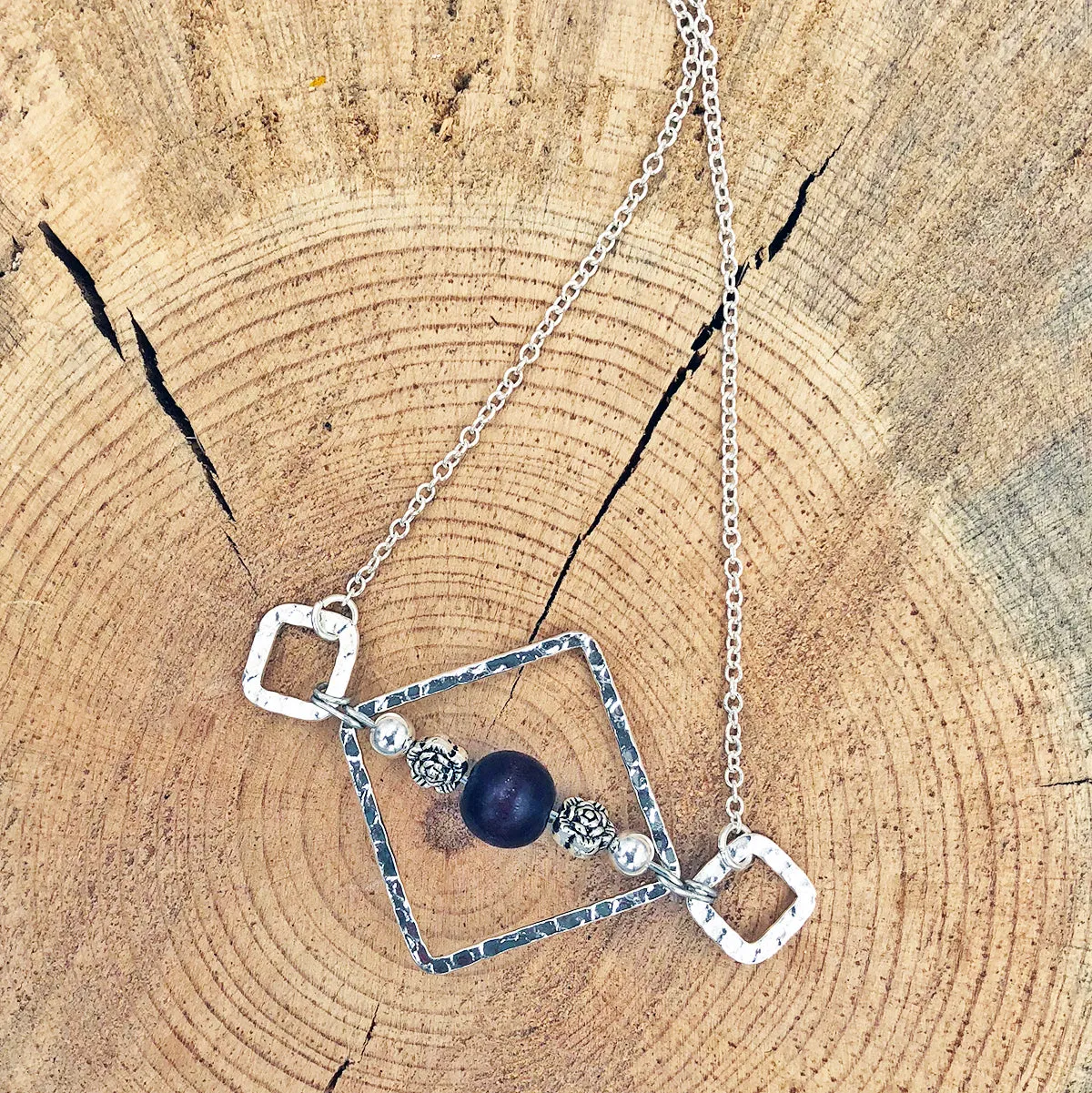 Geometric Necklace with Wood Bead and Metallic Floral Accents