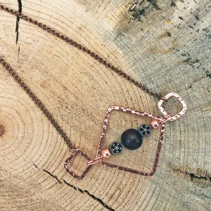 Geometric Necklace with Wood Bead and Metallic Floral Accents