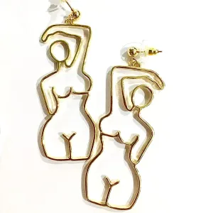 HER STATEMENT EARRINGS