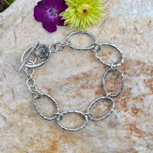 Oval hammered hand cast sterling silver bracelet